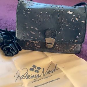 PATRICIA NASH vintage small black leather tooled design messenger bag.